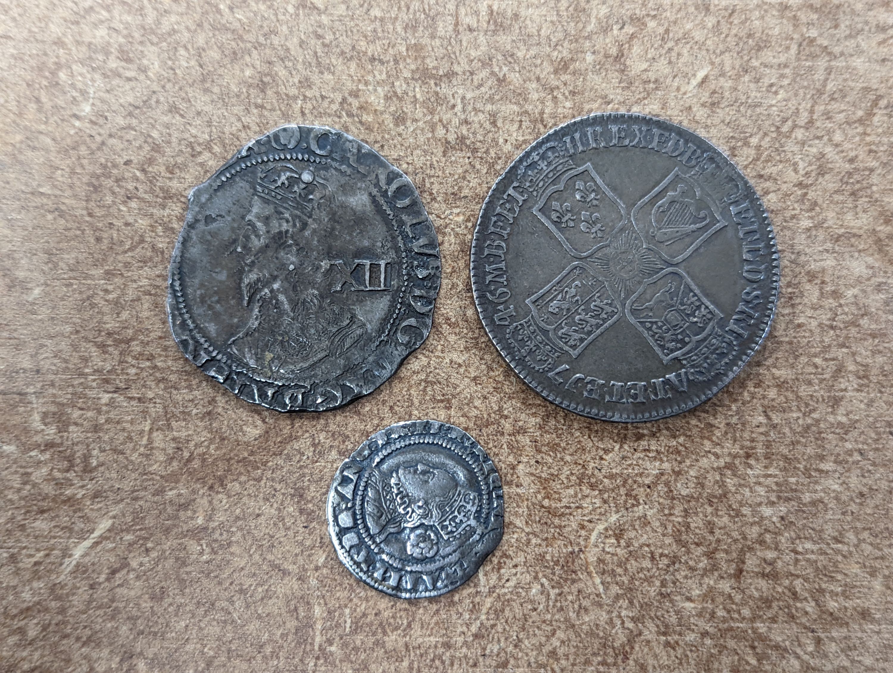 A George II half crown Lima 1746, good F, an Edward VII shilling, a Charles II shilling 1644, incomplete flange VG, and a Queen Elizabeth I threepence 1572, mm. Eglantine (4)